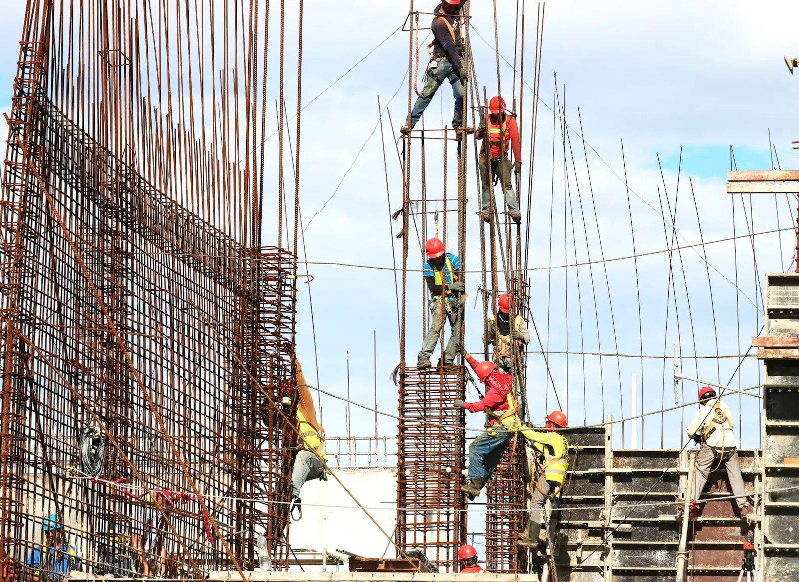 Workers tying reinforcement steel on site