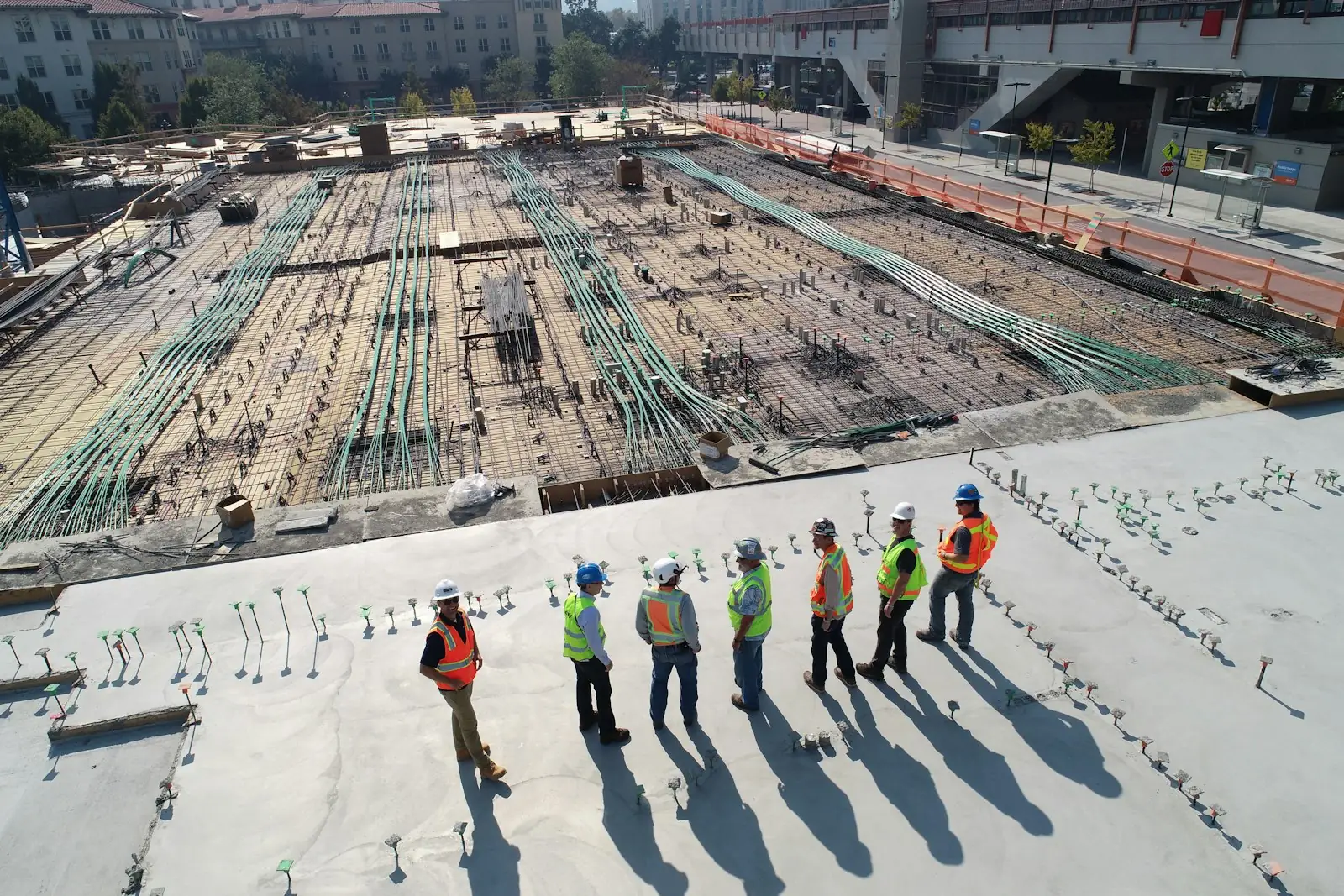 Site engineers reviewing a slab under construction