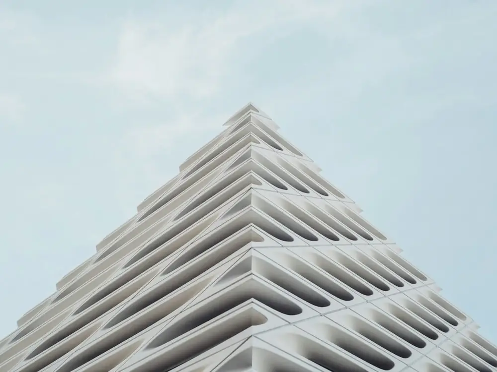 Modern white building with layered geometric facade