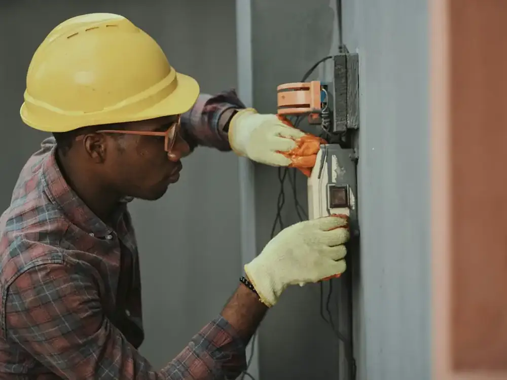 Technician working on an electrical panel